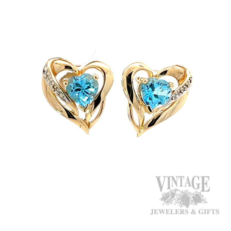 Heart shaped Swiss blue topaz and gold earrings front