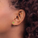 14 karat yellow gold Peridot 5mm pierced stud earrings on model