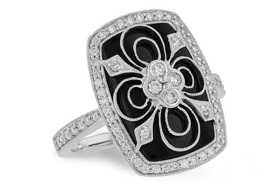 14 karat white gold filigree vintage inspired ring with diamonds overlaying an onyx background