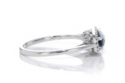 14kw gold East-West London blue topaz and diamond halo ring, side view