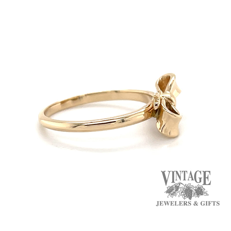 14 karat yellow gold ribbon bow design ring, side view