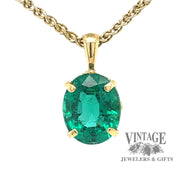 Heirloom quality natural emerald 18ky gold pendant hanging