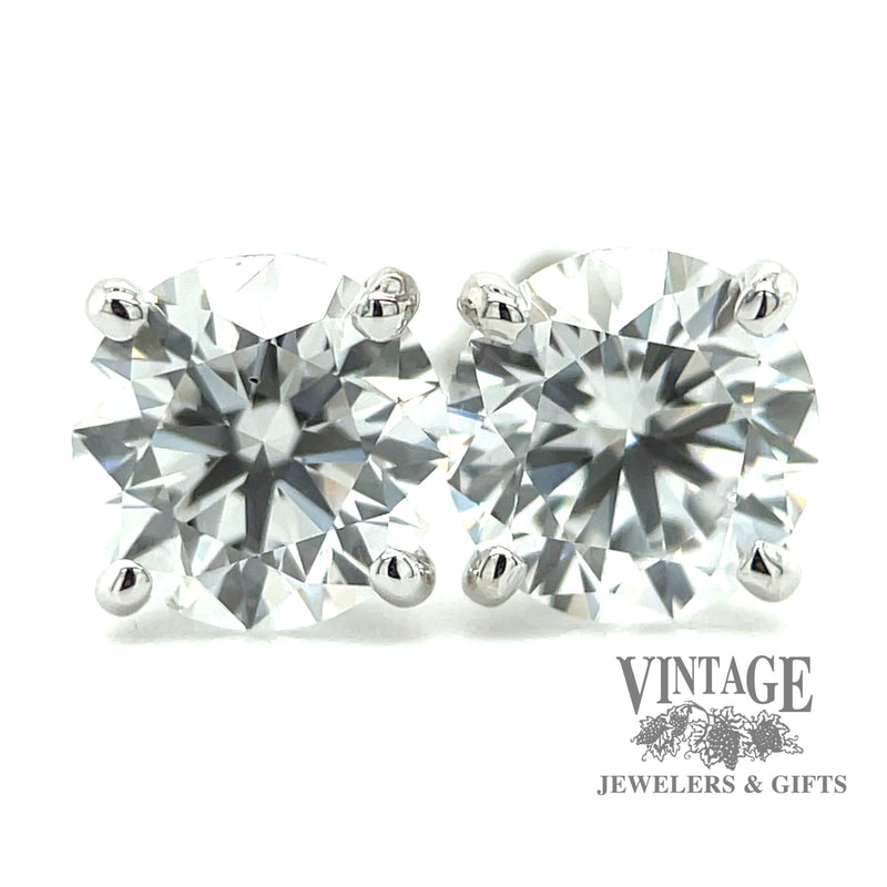 14 karat white gold 2.06 ct. total weight round lab grown diamond stud earrings, close up