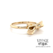 14 karat yellow gold ribbon bow design ring, angled view