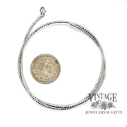 14 karat white gold 17" round spiral mesh choker necklace, shown with a quarter for size reference