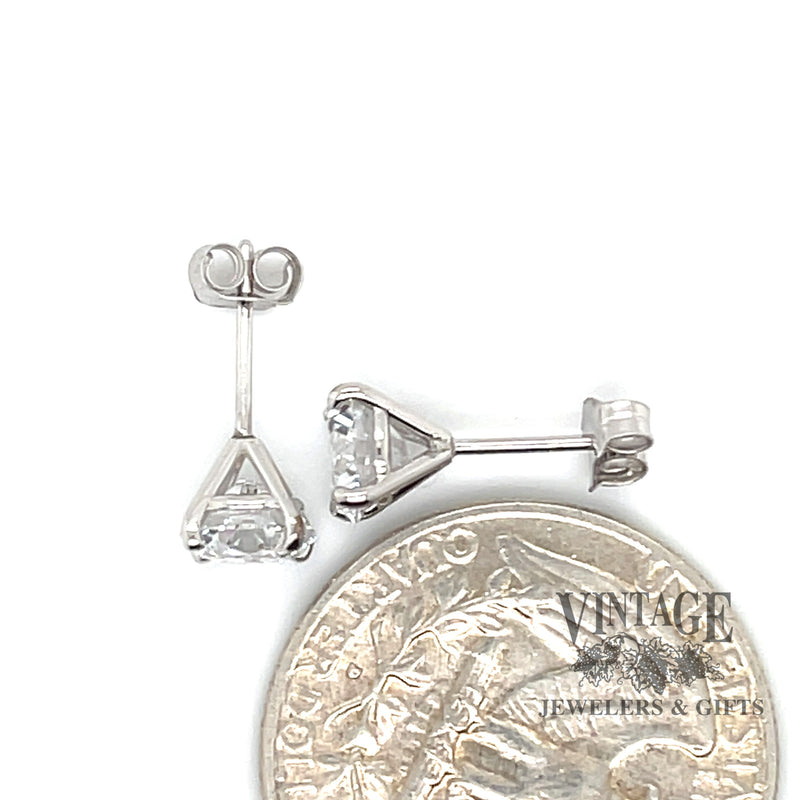 14 karat white gold 2.0ctw round lab grown diamond stud earrings, shown with quarter for size reference
