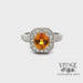 Revolving video of 18kw gold 1.80ct Orange sapphire diamond pave halo ring