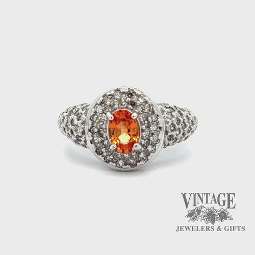 Revolving video of 10kw gold oval spessartine diamond pave ring