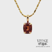 Revolving video of 14 karat yellow gold 2.25ct orange hessonite garnet pendant