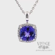 Cushion shaped tanzanite and diamond 14k white gold halo pendant rotating video