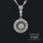 Revolving video of 18kw gold antique 1.12ctw diamond halo pendant