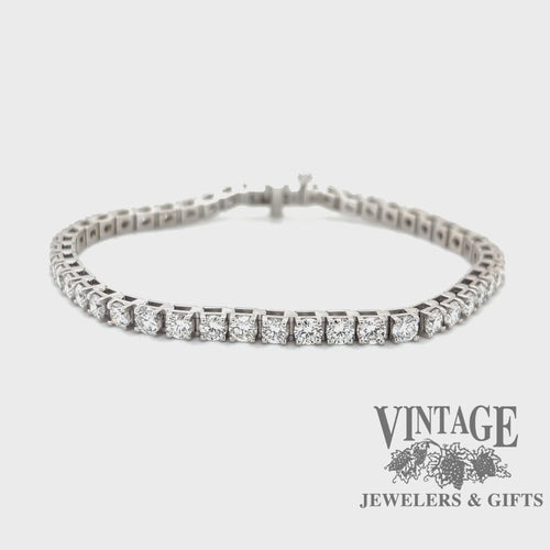 Revolving video of 14 karat white gold 7 ctw natural diamond tennis bracelet