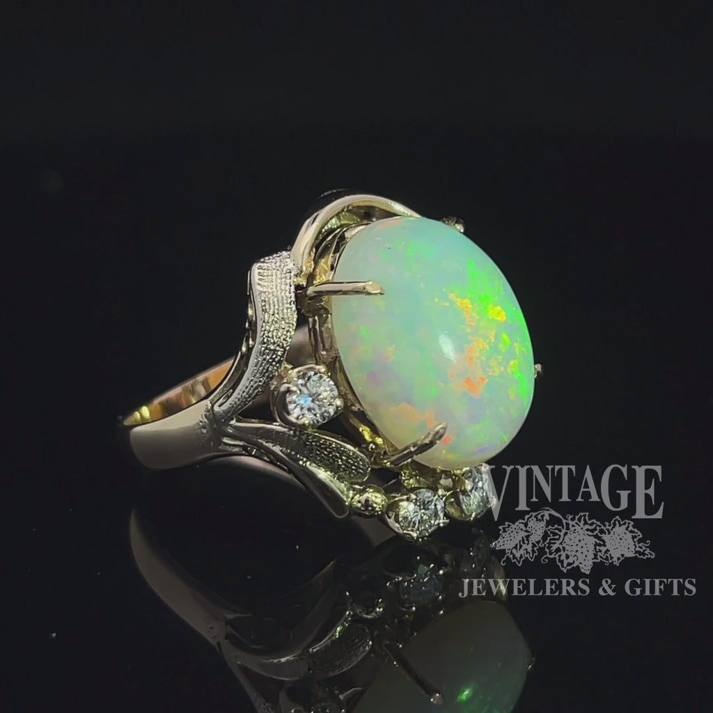 Revolving video of 14 karat gold crystal opal and diamond ring