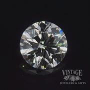 1.29 carat, round brilliant, M color, SI1 clarity, natural diamond