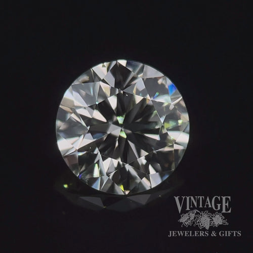 1.29 carat, round brilliant, M color, SI1 clarity, natural diamond