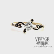 revolving video of 14 karat yellow gold scroll motif .29 carat diamond solitaire ring
