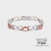 Revolving video of 18kw gold Precious topaz and diamond estate bracelet