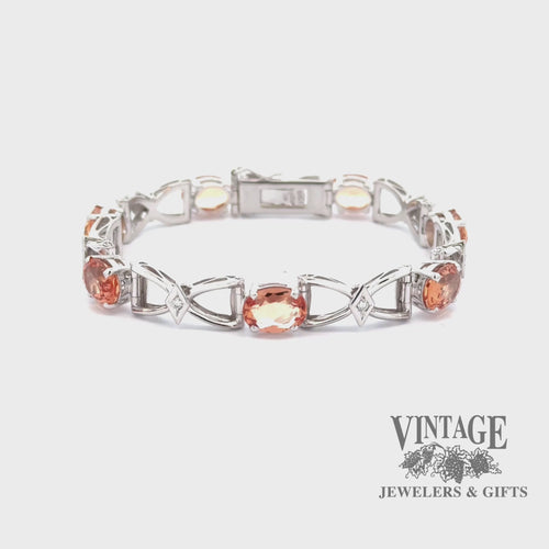 Revolving video of 18kw gold Precious topaz and diamond estate bracelet