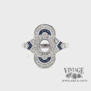 Elongated oval diamond and caliber cut sappire 14kw gold ring video