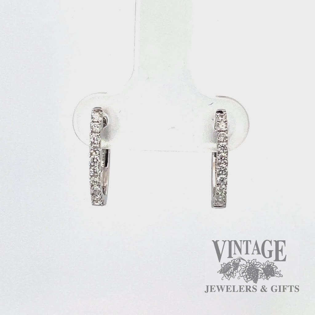 Video 14k white gold oval huggie diamond earring