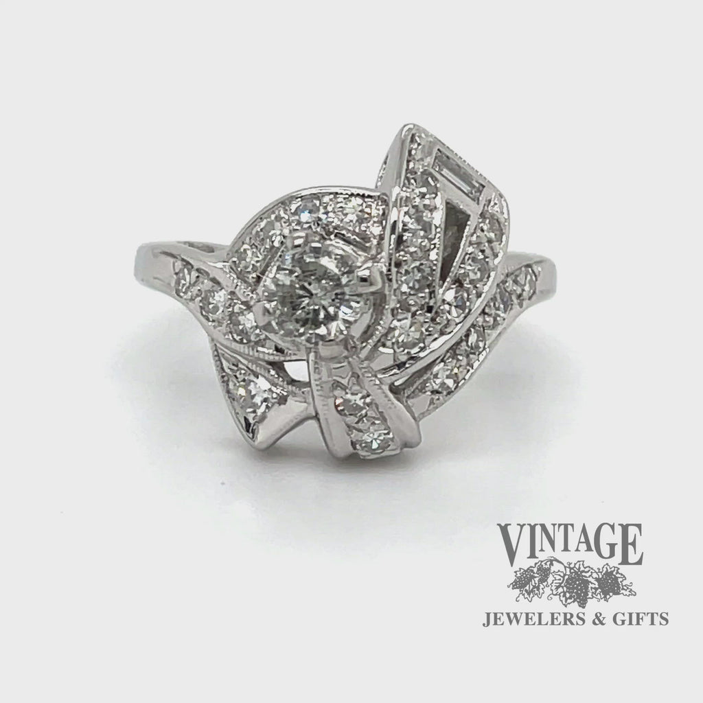 Revolving video of Vintage Art Deco 14 karat white gold diamond pave bow motif ring