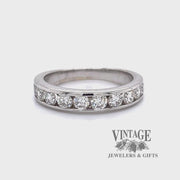 Revolving video of 18 karat white gold channel set diamond band