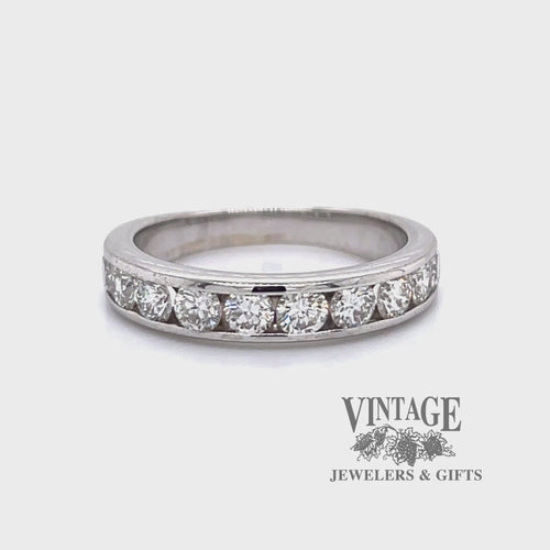 Revolving video of 18 karat white gold channel set diamond band