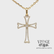 Revolving video of 14 karat yellow gold diamond outlined cross