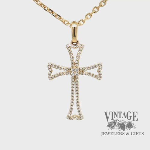 Revolving video of 14 karat yellow gold diamond outlined cross