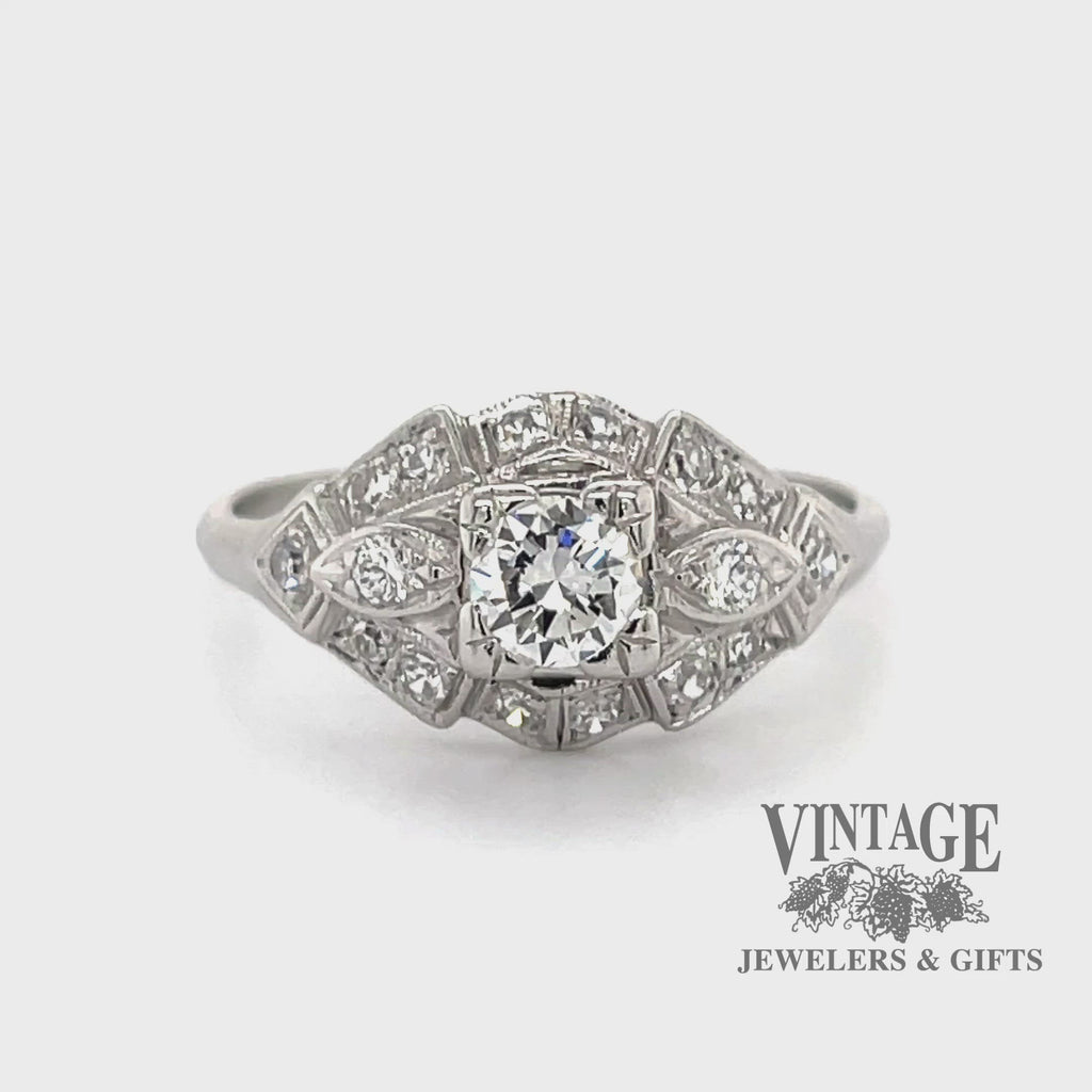 Revolving video of .64 carats total weight vintage platinum Art Deco diamond ring