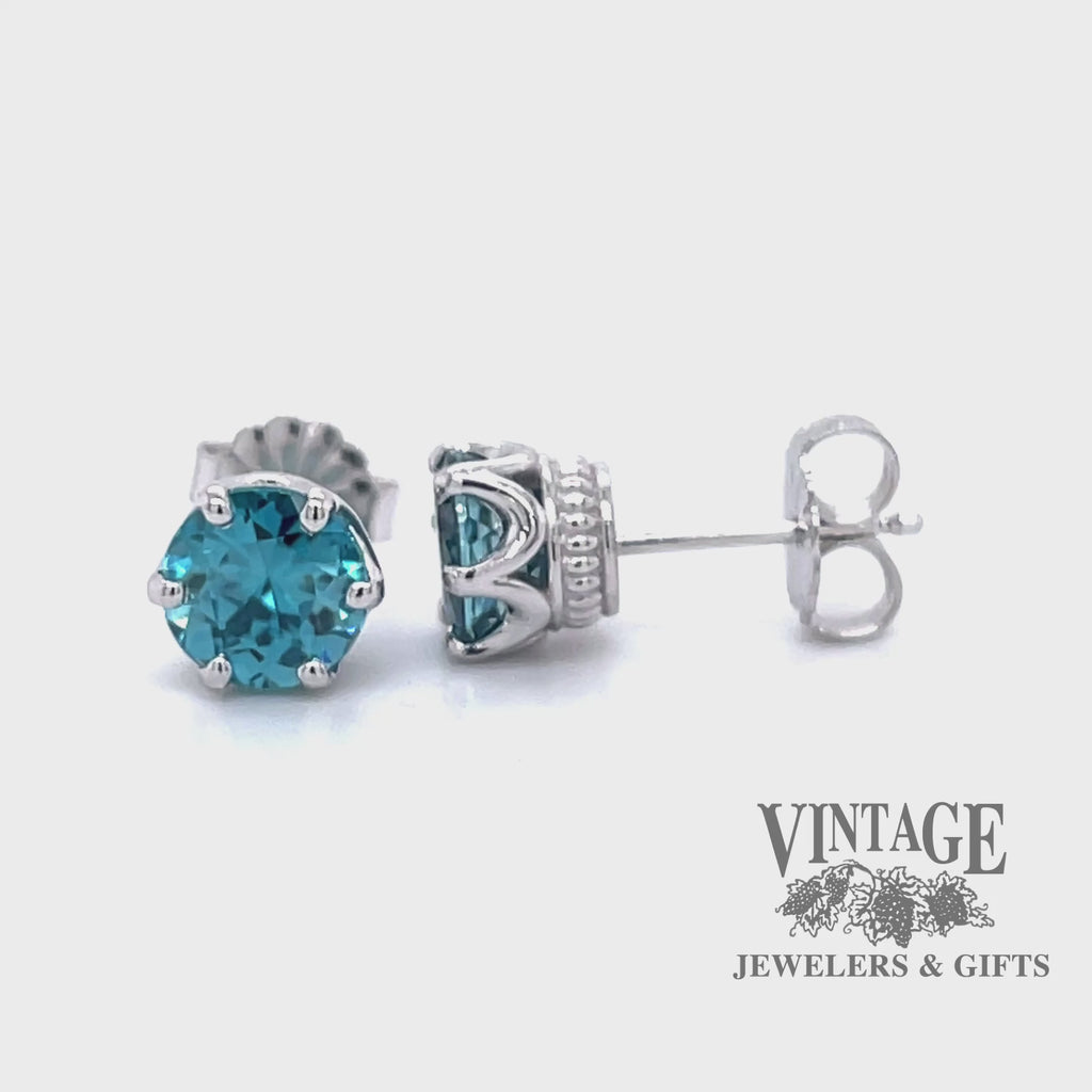 Revolving video of 14 karat white gold 2.78 carat total weight blue zircon pierced stud earrings