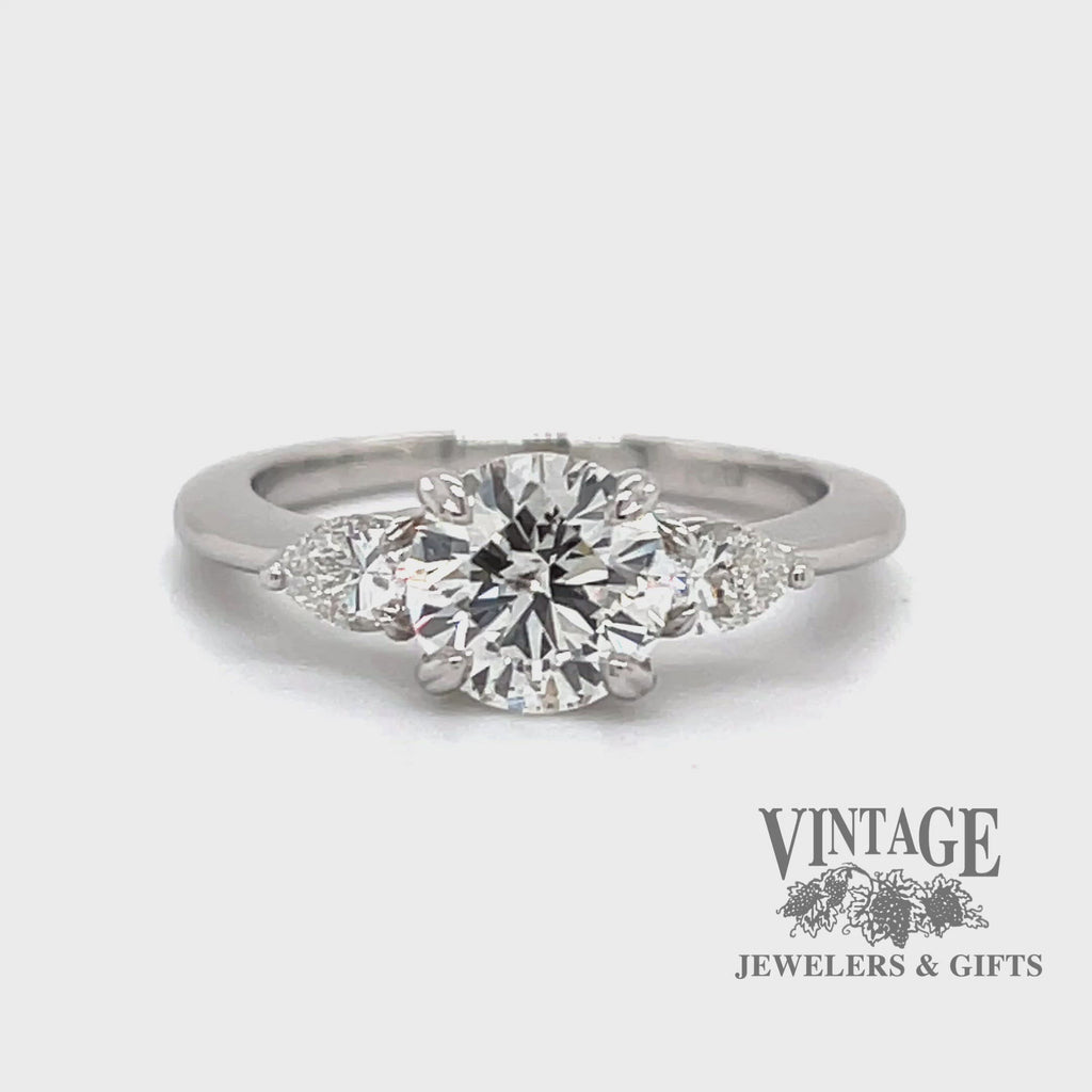 Revolving video of Platinum 1.28ctw round and pear-shape 3-diamond ring