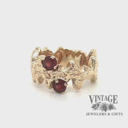 Revolving video of 14 karat yellow gold Garnet free form ring