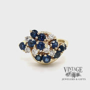 Revolving video of 14 karat yellow gold estate sapphire and diamond cluster ring