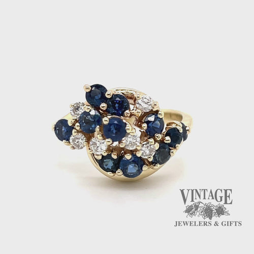Revolving video of 14 karat yellow gold estate sapphire and diamond cluster ring