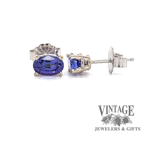 Revolving video of 14 karat white gold oval tanzanite earrings