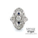 Revolving video of  Vintage 18k white gold filigree OEC diamond and sapphire ring