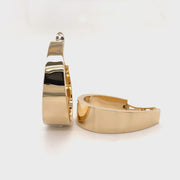 Revolving video of Large flat tapered 14ky gold hoop earrings