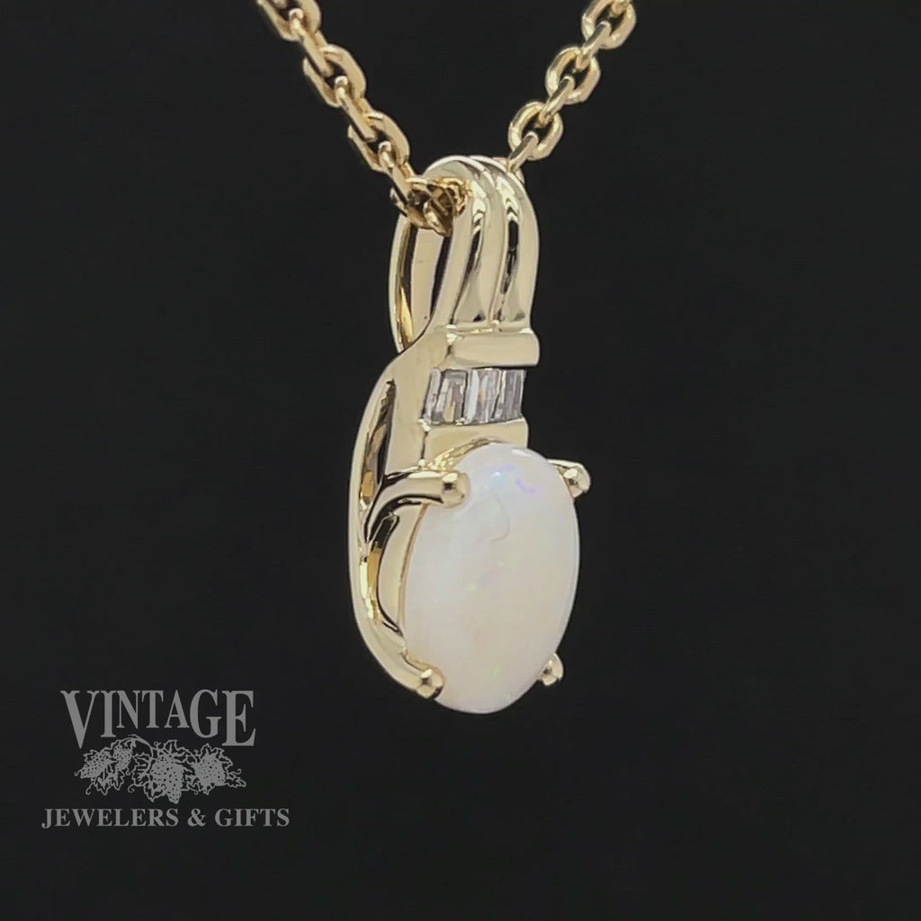 Revolving video of 10 karat yellow gold white opal and diamond pendant