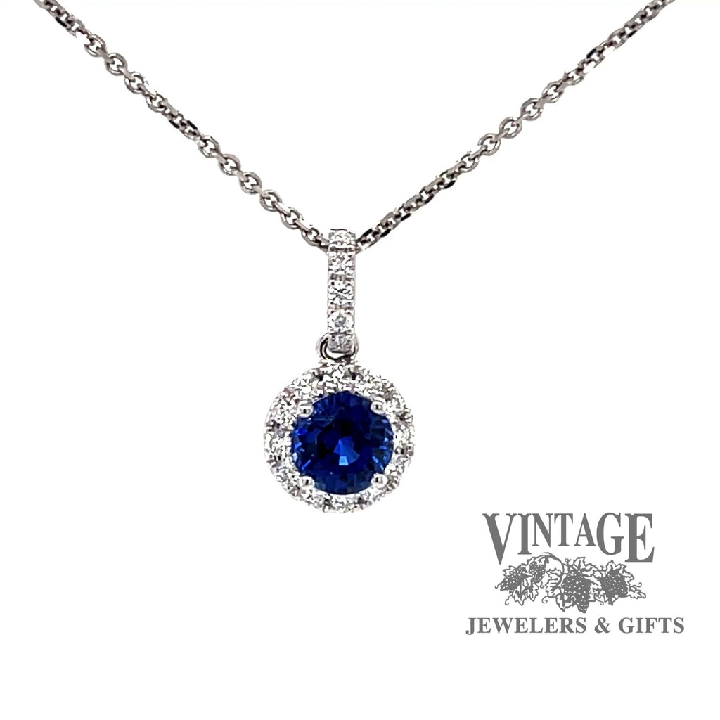 Revolving video of 18k white gold Blue sapphire and diamond halo pendant
