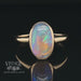 Revolving video of  14 karat yellow gold oval bezel set opal contemporary ring
