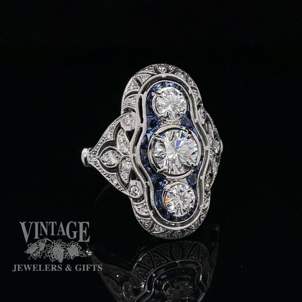 Revolving video of  14k white gold vintage inspired filigree 3-stone diamond and sapphire ring