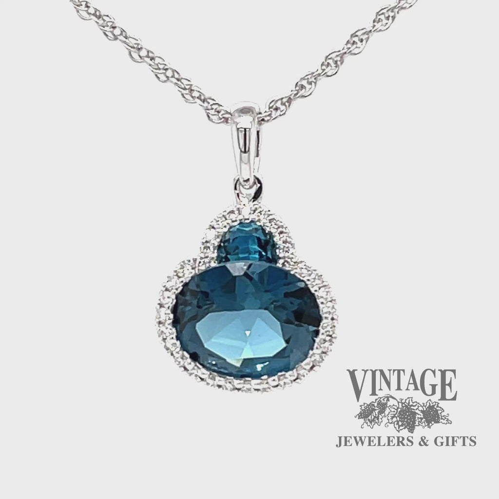 Revolving video of 14 karat white gold 2.86 carat total weight Blue Topaz and diamond halo necklace