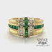 Revolving video of 18 karat yellow gold emerald and diamond channel set band ring