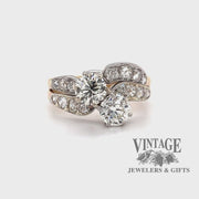 Revolving video of 14 karat yellow and white gold 2.38 carat total weight diamond two stone vintage bypass ring