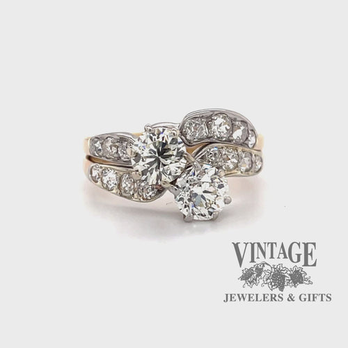 Revolving video of 14 karat yellow and white gold 2.38 carat total weight diamond two stone vintage bypass ring