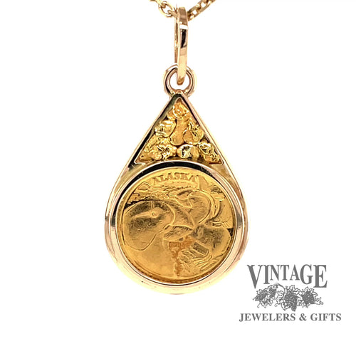Revolving video of 14 karat yellow gold estate state of Alaska 1/10 oz commemorative coin pendant