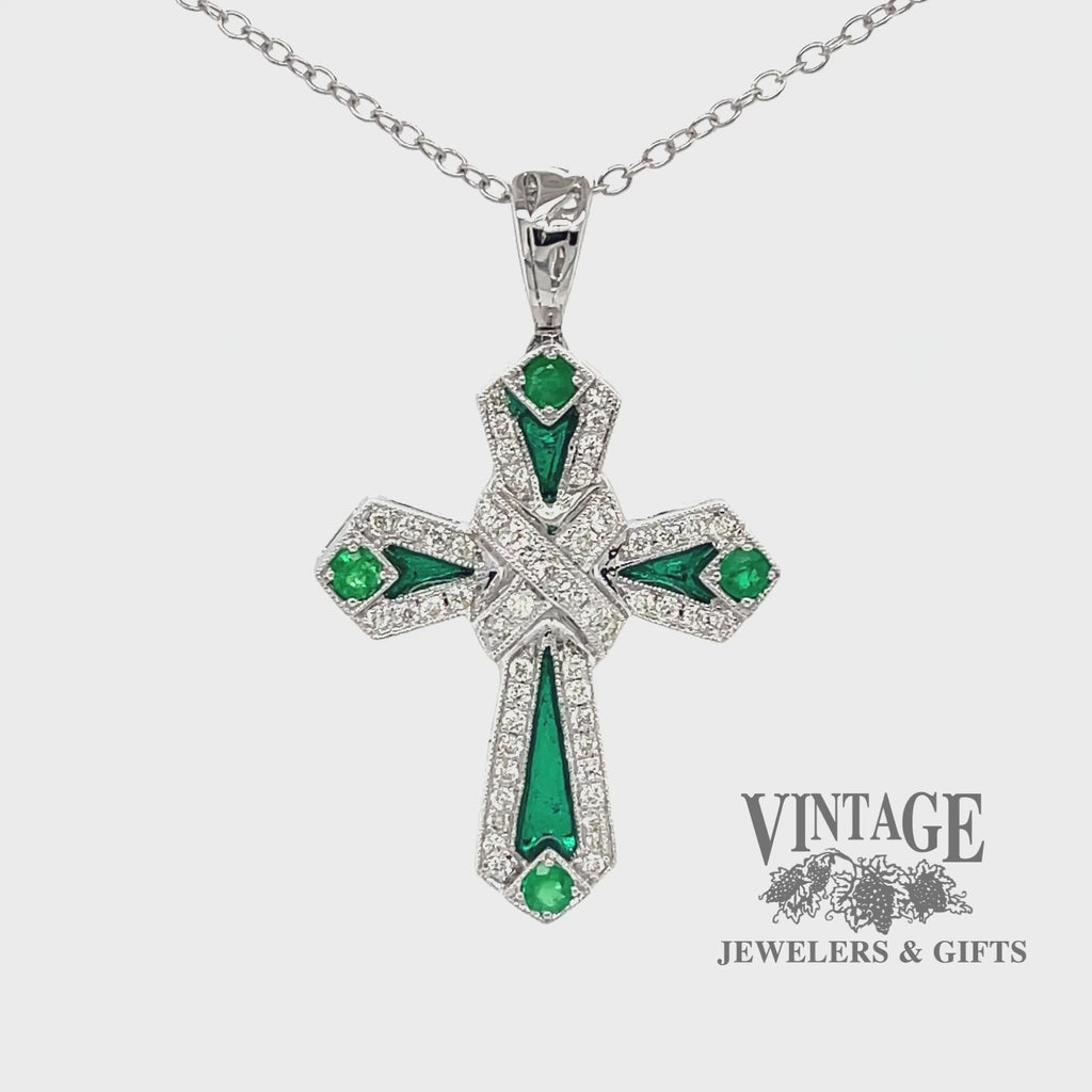 Revolving video of 14 karat white gold emerald, diamond and enamel cross pendant