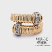 Revolving video of 18 karat yellow gold fluted bypass diamond ring