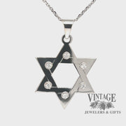 Revolving video of 14 karat white gold Star of David pendant with diamonds